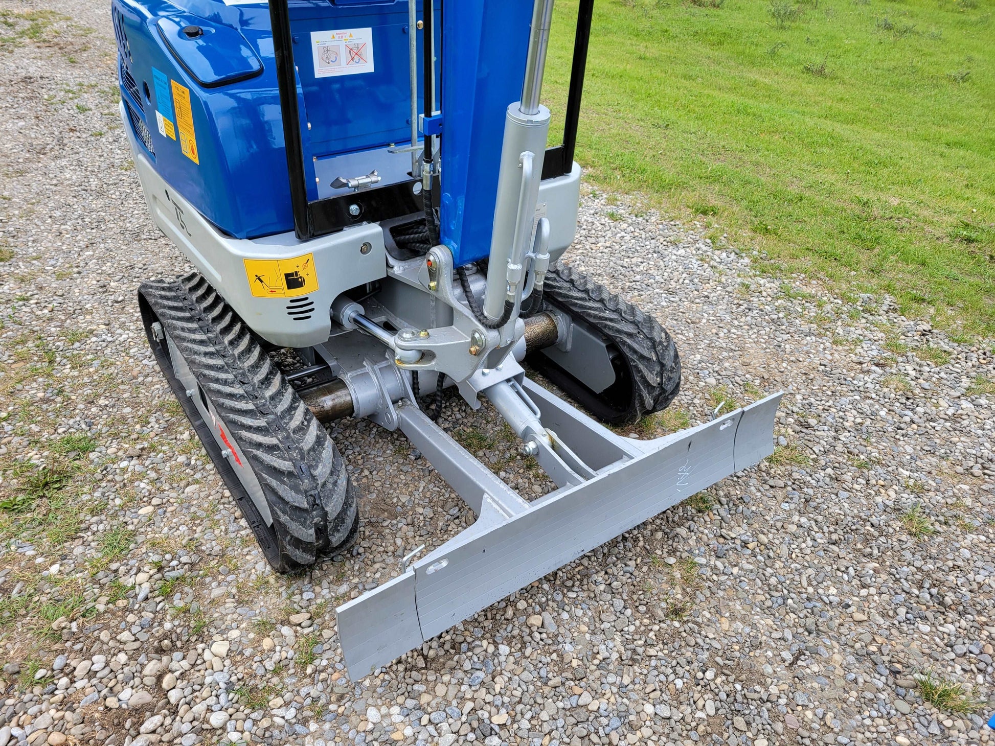 Close-up of JoyT5 1.2 ton mini excavator for rent in Calgary, Alberta compact excavator track and front blade system built for precise grading and stable digging in Canada.