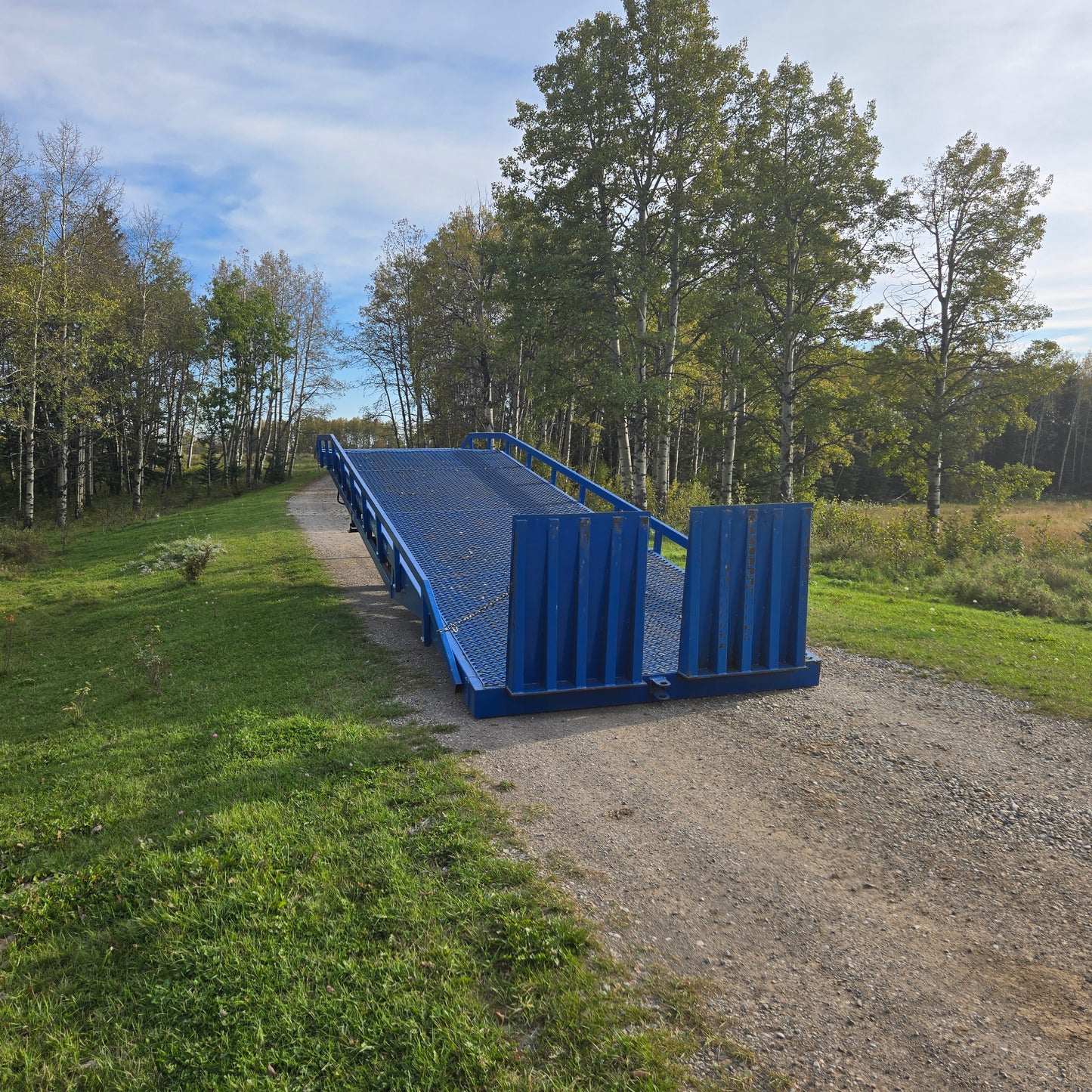 Front view of 12 ton mobile loading ramp for sale in Canada, JoyT5 heavy-duty steel dock ramp for forklifts, trucks, and container loading.