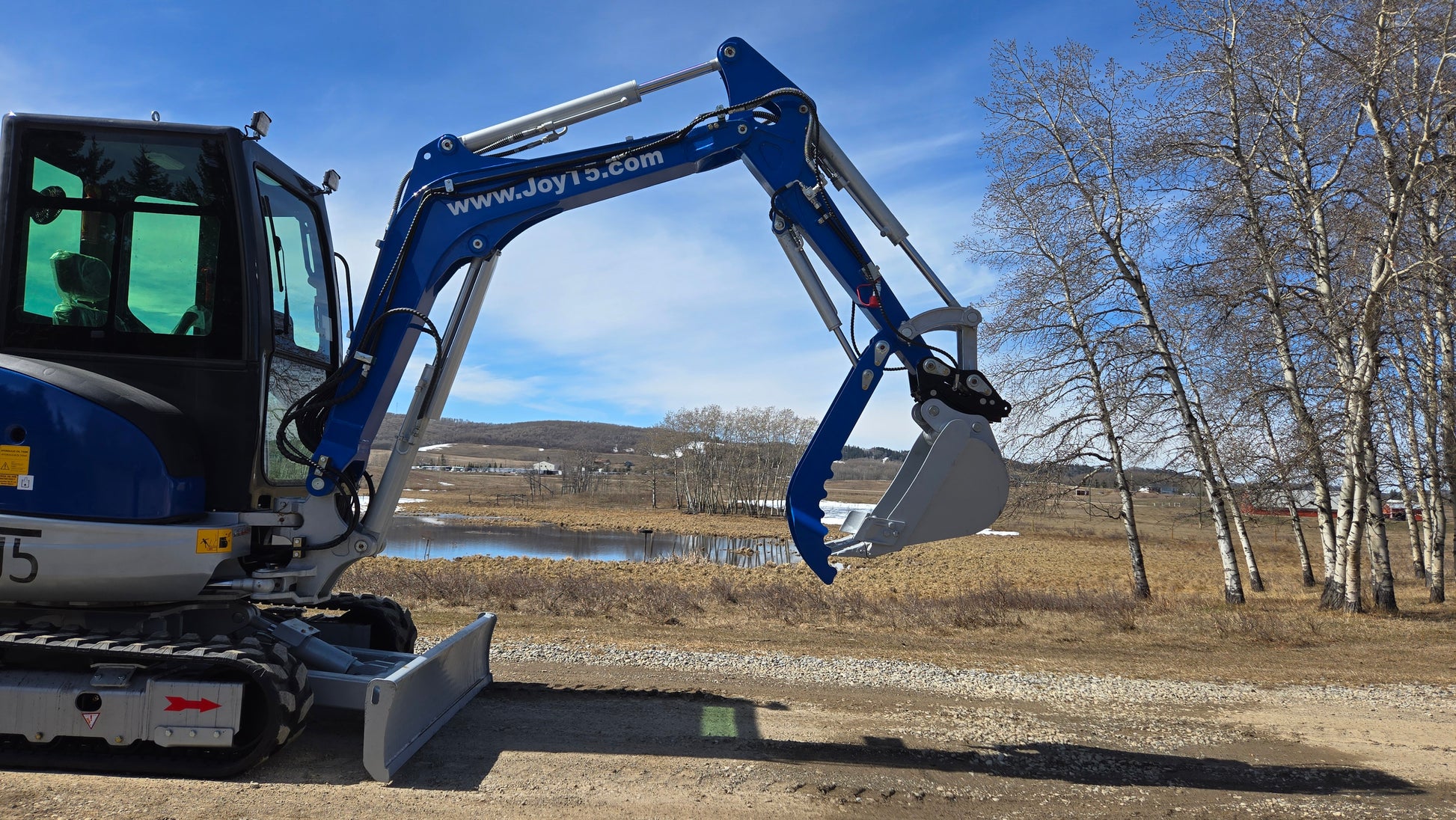 JT5350 3.5 ton mini excavator with Kubota engine hydraulic arm extended near pond Canada compact excavator for construction and earthmoving work