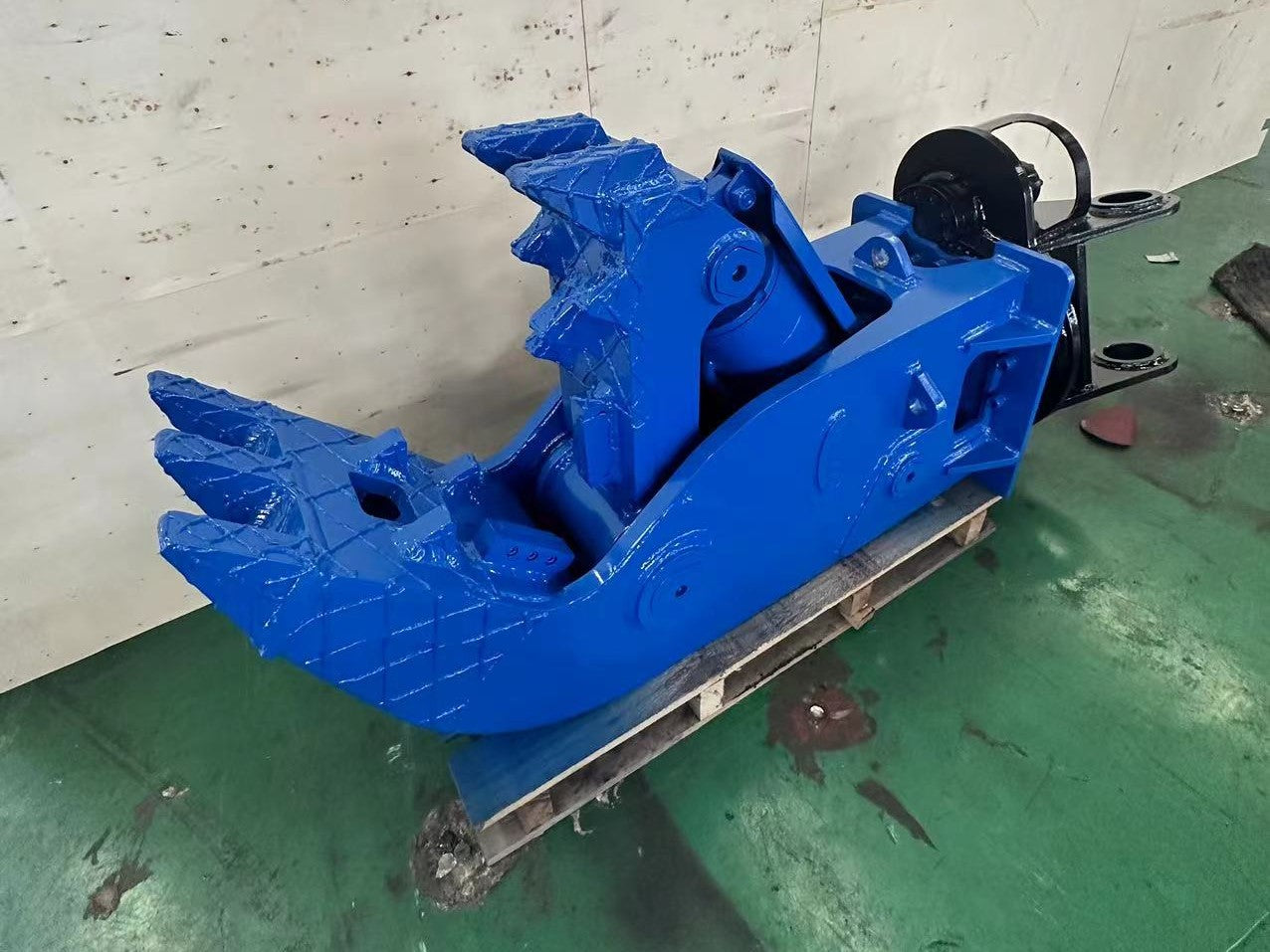 Blue heavy duty hydraulic concrete pulverizer for excavator made in Canada used for crushing reinforced concrete and stone in demolition and recycling