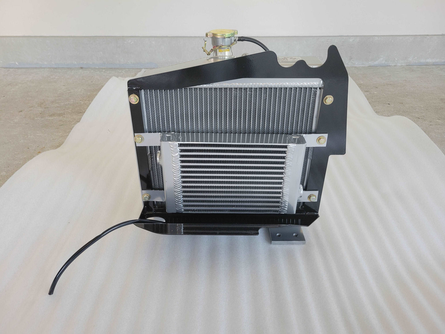 OEM radiator and oil cooler assembly by JoyT5 – high‑efficiency cooling system component for excavators, skid steers and wheel loaders. Durable replacement part available in Calgary, Canada.