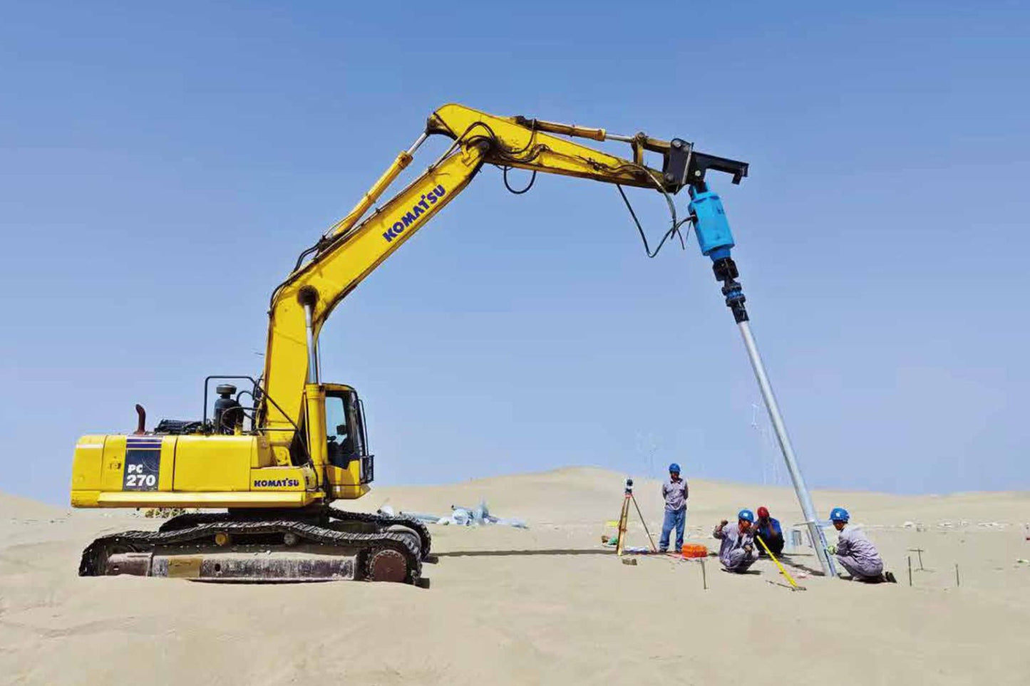 Excavator-mounted JT5 AAS-360 wireless alignment indicator and angle sensor used in auger drilling for foundation piles – precision alignment tool for construction and excavation equipment.