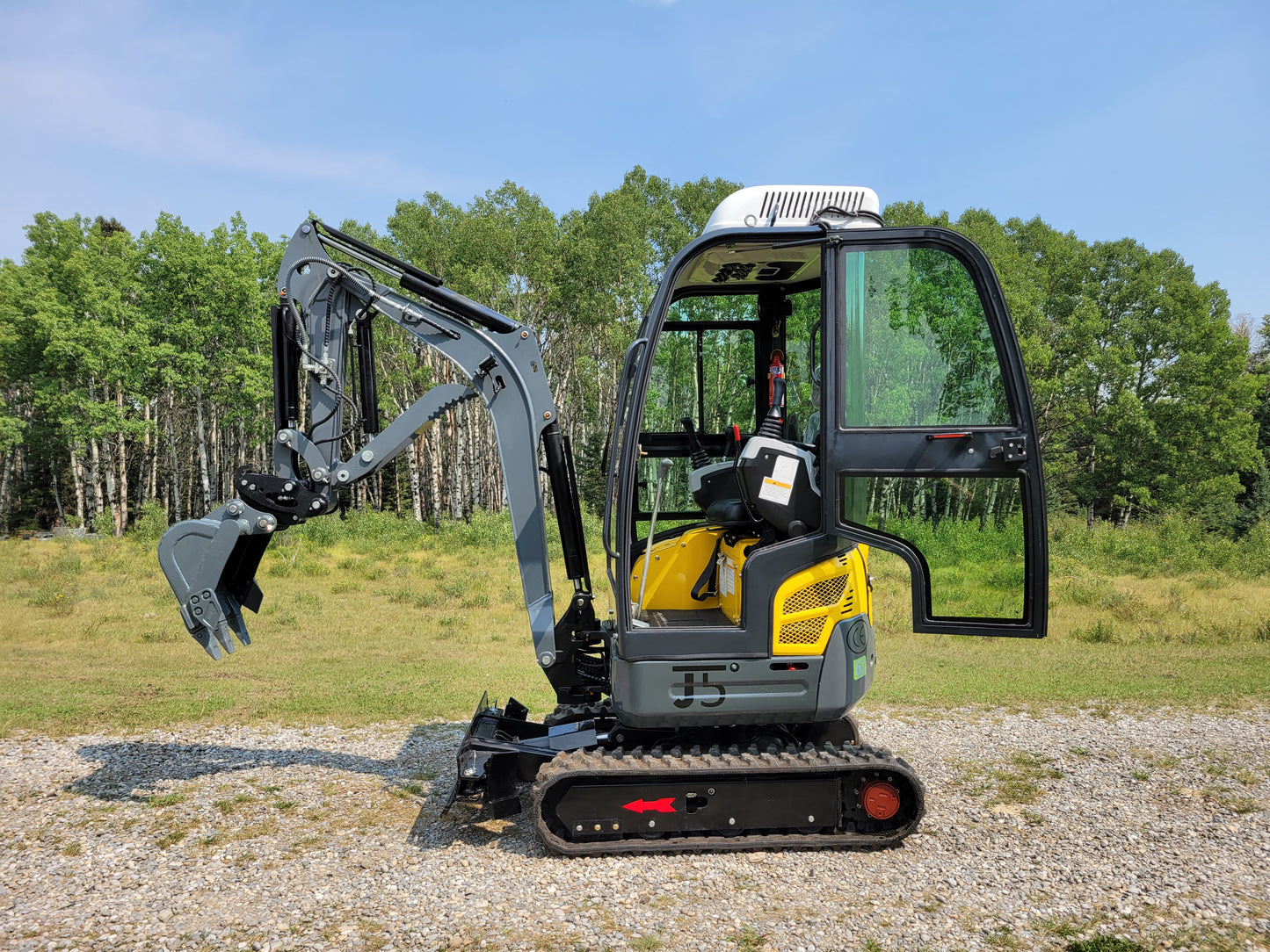 JT5200 Special Edition 2 ton mini excavator for sale in Canada with Kubota engine side view open cab showing operator seat and hydraulic bucket compact excavator for construction projects