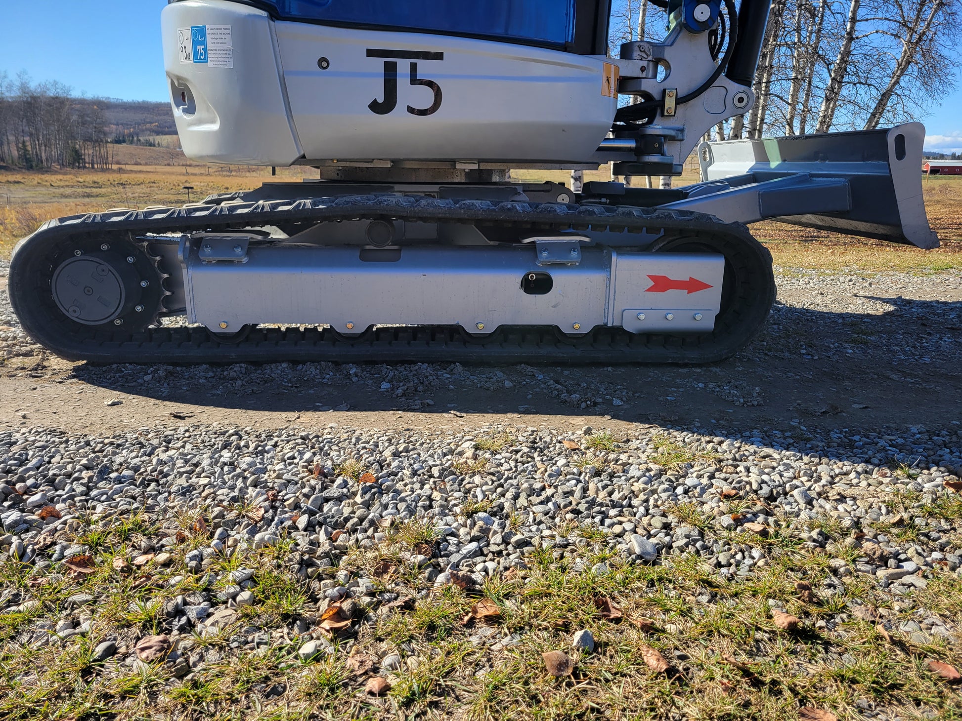JT5350 3.5 ton mini excavator with Kubota engine detailed view of heavy duty track system and blade ideal for compact construction and landscaping use in Canada