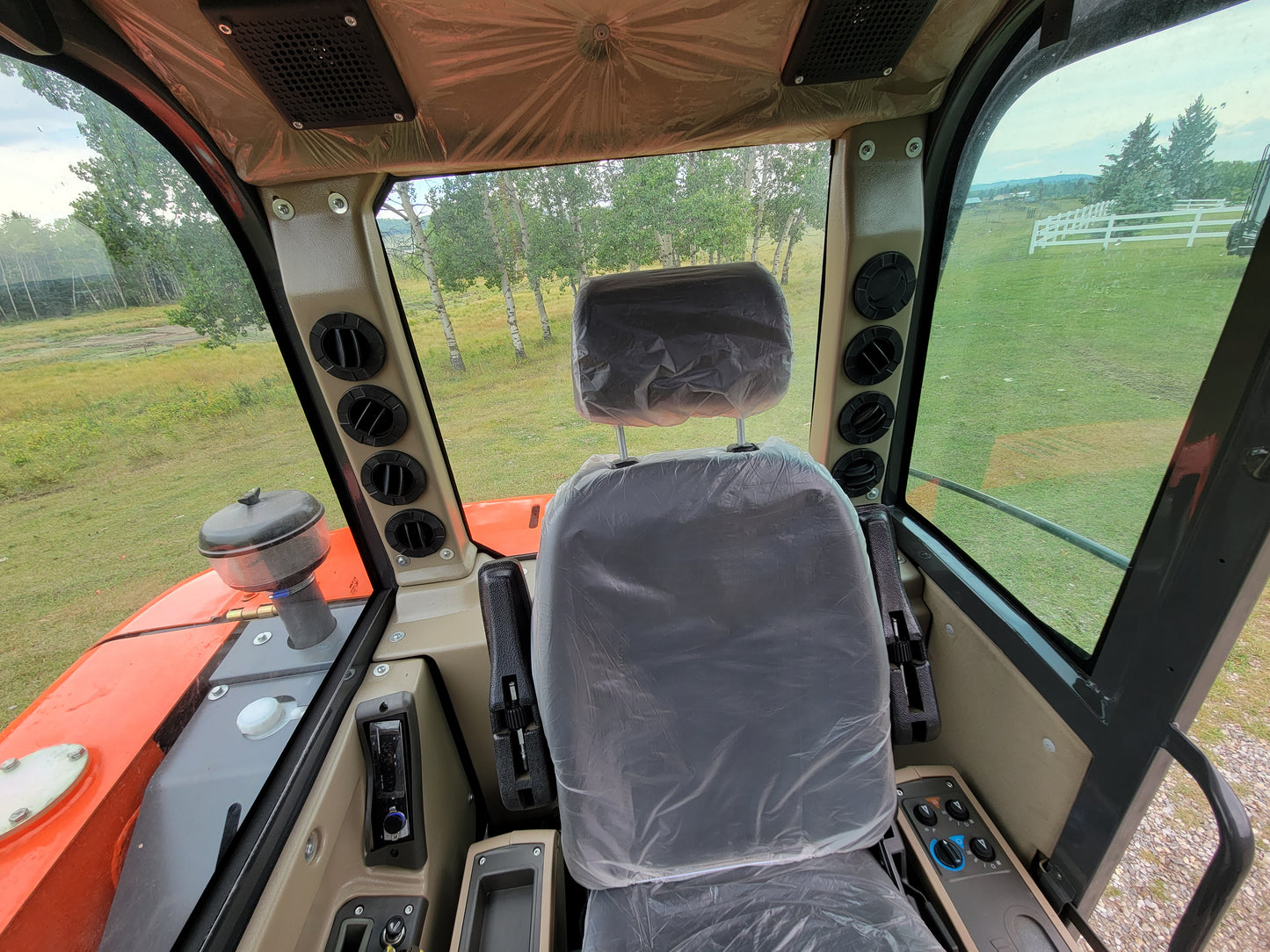 JT5600 6 ton mini excavator for sale in Canada powered by Yanmar engine cabin interior view comfortable operator seat and control panel compact construction machine for landscaping work