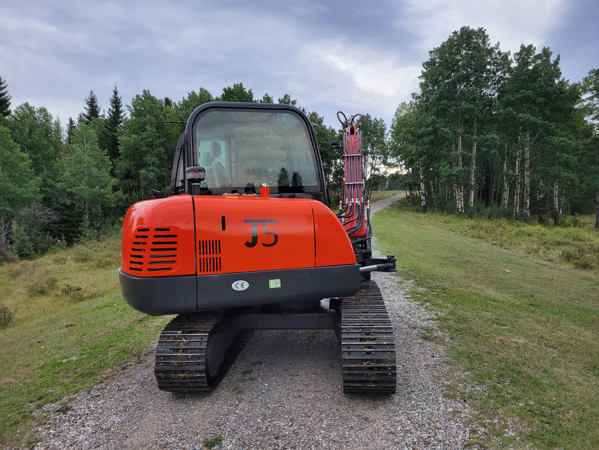JT5600 6 ton mini excavator for sale in Canada powered by Yanmar engine rear view compact construction equipment durable small excavator standing on field for landscaping and projects
