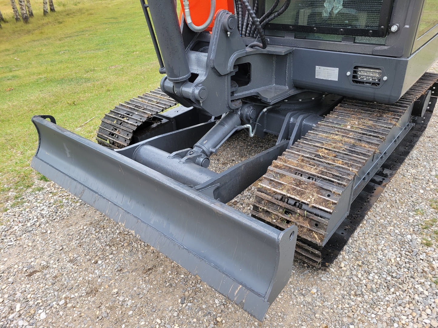 JT5600 6 Ton Mini Excavator – front dozer blade with undercarriage steel tracks on gravel ground
