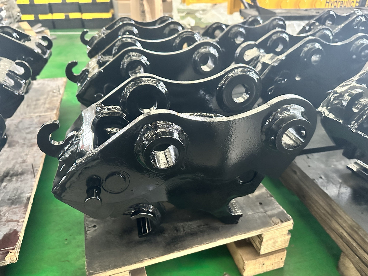 Mechanical excavator quick hitch couplers in factory production showing heavy equipment attachment for Canada by JoyT5