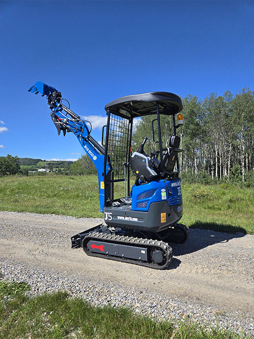 Rippa R15 mini excavator for sale side view with raised bucket on gravel road