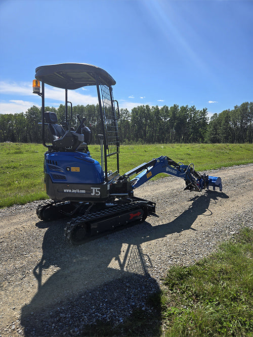 Compact rippa r15 mini excavator for sale side view on gravel road with open field background