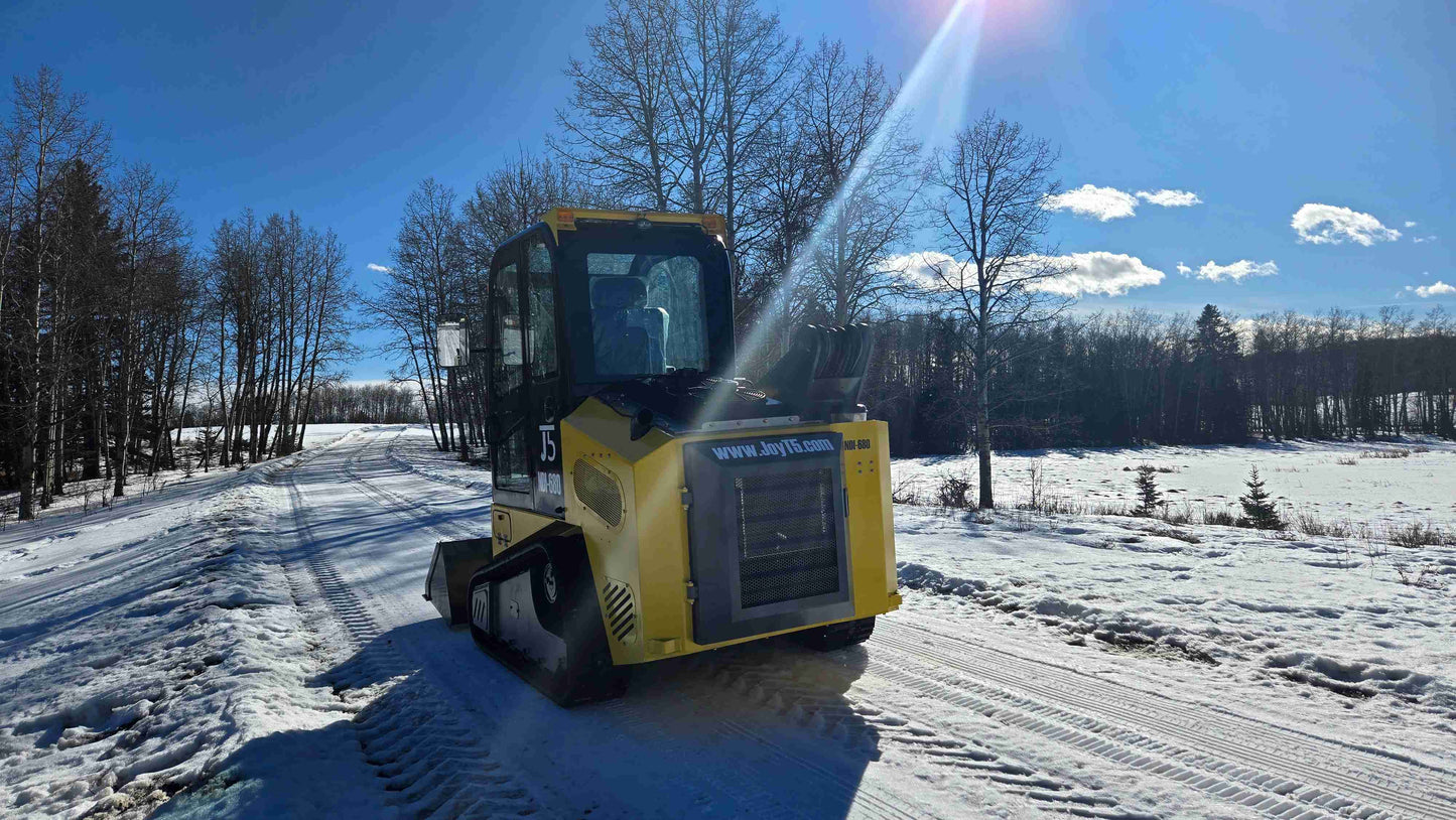 Rippa NDI680 skid steer loader 74 HP compact machine on snowy road in Canada – heavy duty skid steer for construction and lifting | JoyT5