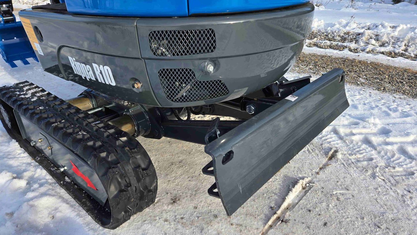 Close-up of Rippa R10 Mini Excavator front blade and rubber tracks on snow