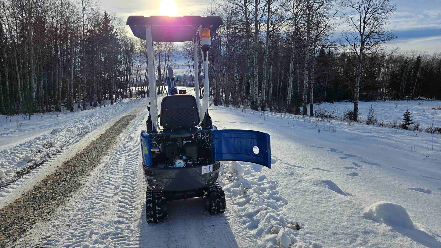 Rippa R10 Mini Excavator rear view with open engine compartment on snowy road