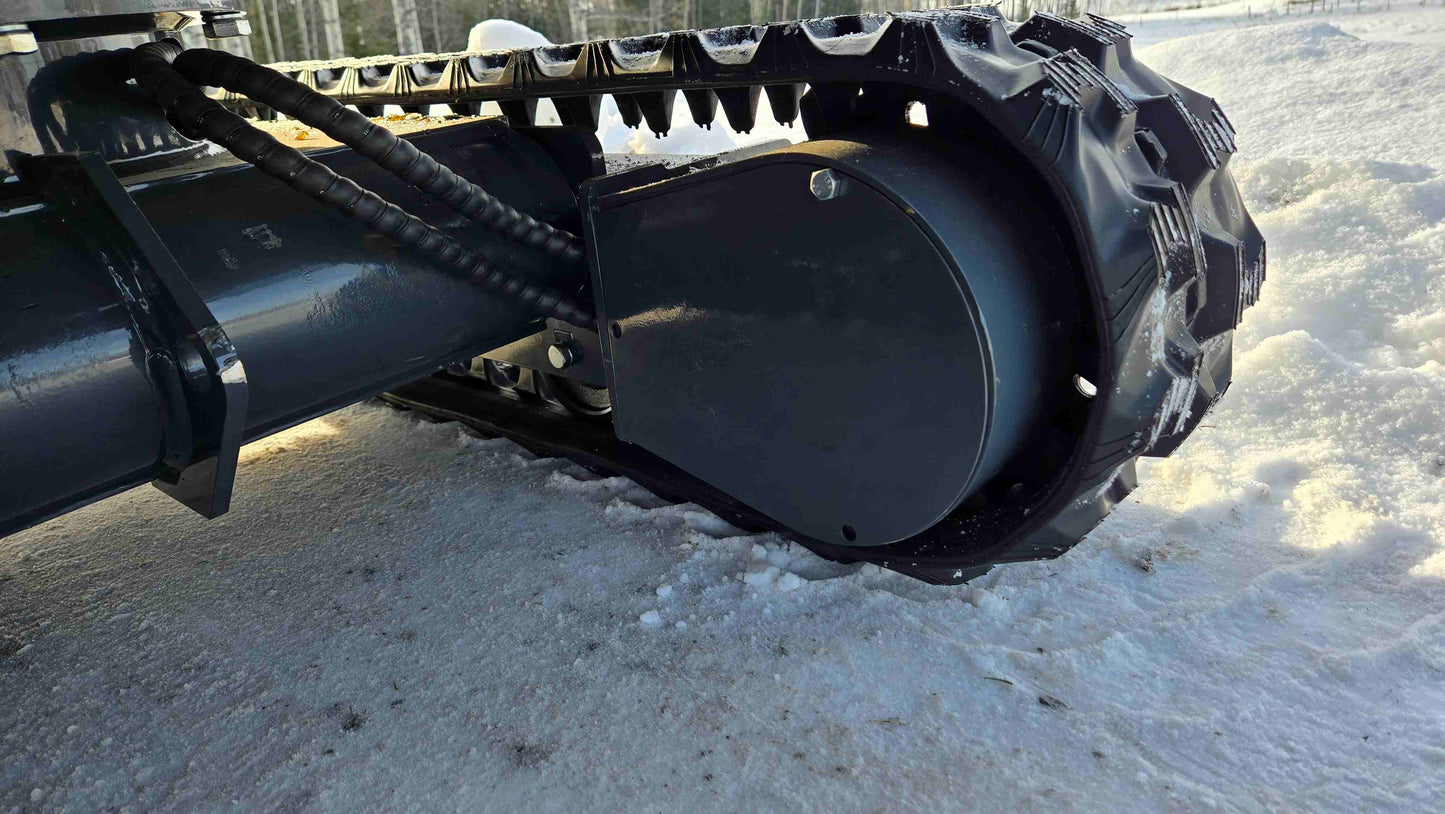Rippa R10 Mini Excavator | Rubber track drive motor and undercarriage side view on snow