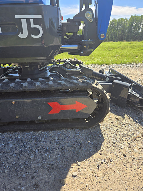 Close-up view of rippa r15 mini excavator for sale rubber track and undercarriage on gravel surface