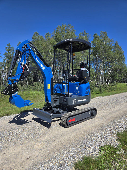Rippa R15 mini excavator for sale side view with lifted bucket on gravel road