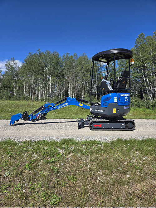 Rippa R15 mini excavator for sale side view with digging arm extended on gravel path