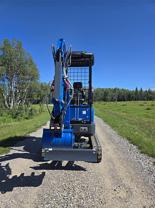 Front view of Rippa R15 mini excavator with digging bucket on gravel road