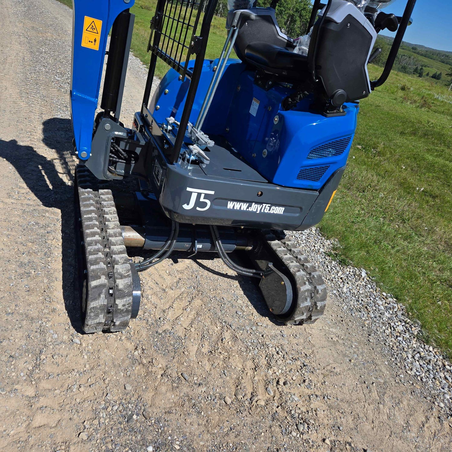Rippa R15 Mini Excavator For Sale – side angle view showing operator seat and rubber track system for reliable digging performance.