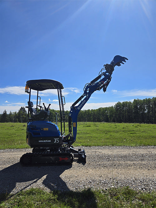 Rippa R15 mini excavator for sale with extended boom arm on gravel road in open field