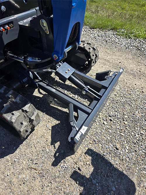 Close up view of rippa r15 mini excavator for sale dozer blade and hydraulic attachment on gravel surface