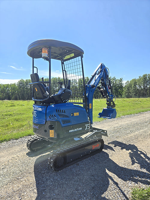 Compact rippa r15 mini excavator for sale side and rear view with operator seat and digging bucket on gravel road