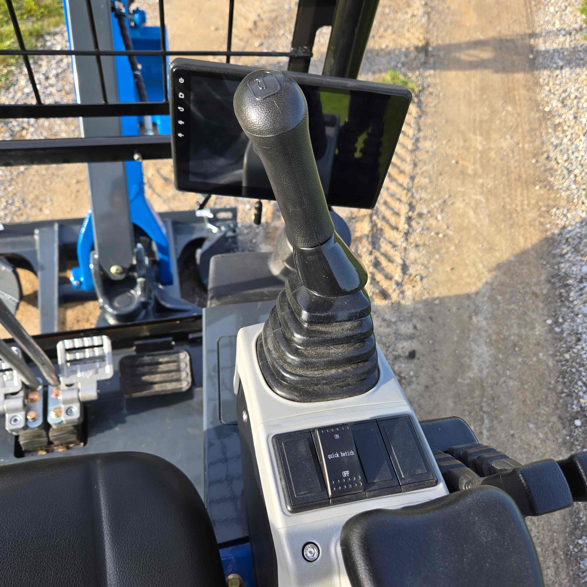 Joystick and digital control panel of Rippa R18 mini excavator inside operator cabin in Canada | Compact excavator JoyT5 for construction and landscaping projects