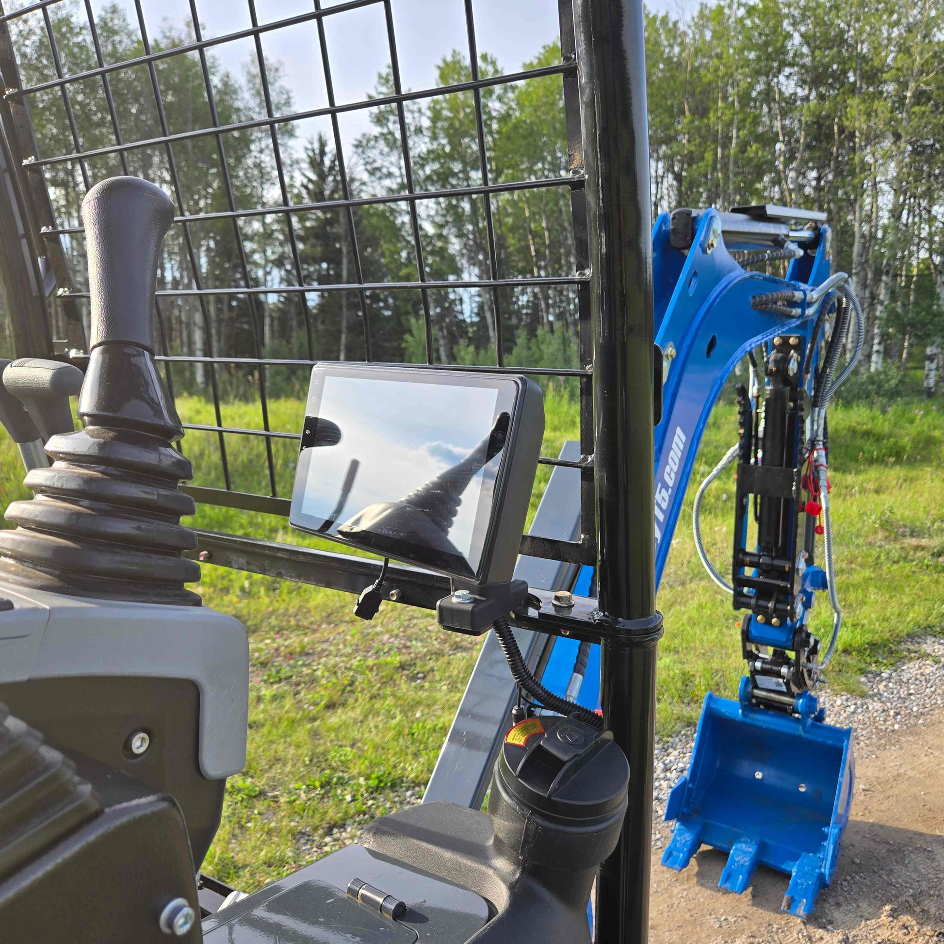 Operator joystick and display monitor view of Rippa R18 mini excavator showing blue digging arm and bucket in Canada | Compact excavator JoyT5 for construction and landscaping projects