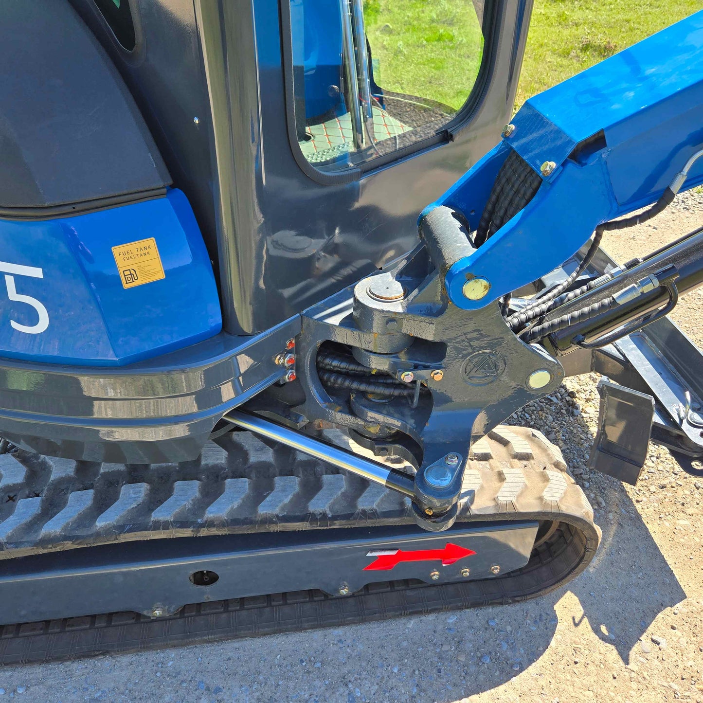 Close-up view of Rippa R22 Mini Excavator for sale hydraulic arm and track system.