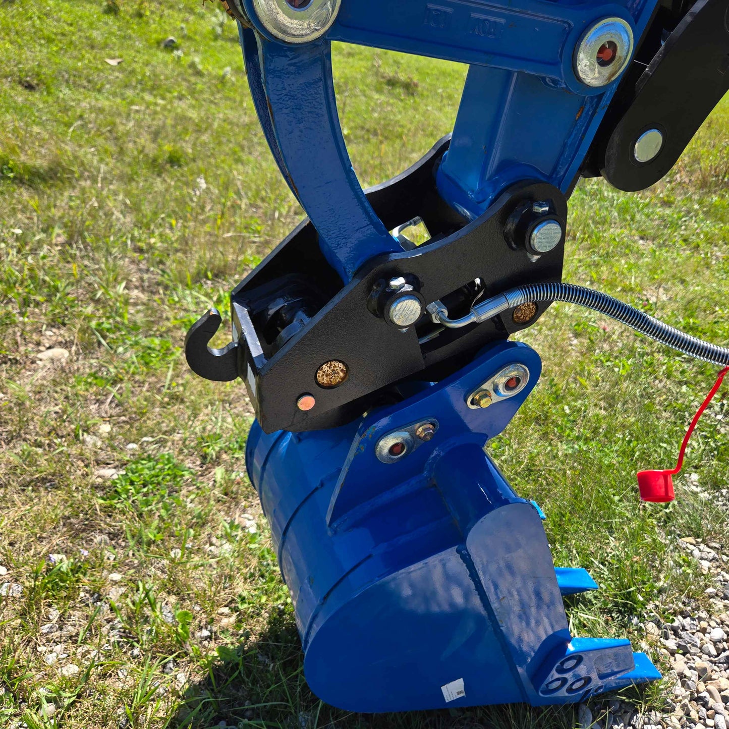Close-up of hydraulic quick coupler system with digging bucket on a Rippa R22 mini excavator, for sale showing strong build and secure attachment.