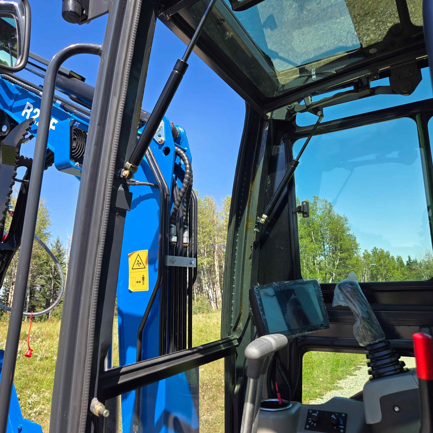Rippa R22 Mini Excavator for sale cabin roof with glass window, support struts, mounted fan, and storage holder.