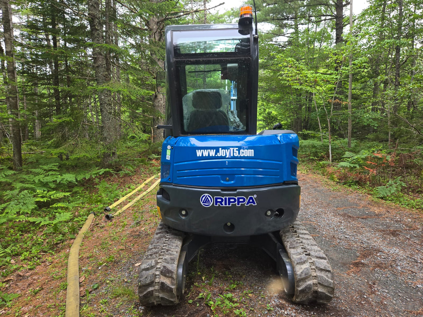 Rear view of Rippa R32 Mini Excavator in Canada, compact excavator with durable tracks and cabin