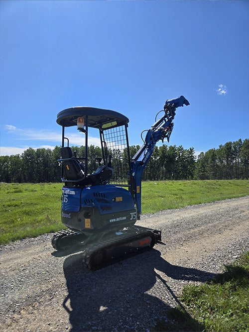 Compact rippa r15 mini excavator for sale side view with raised boom and bucket on gravel road