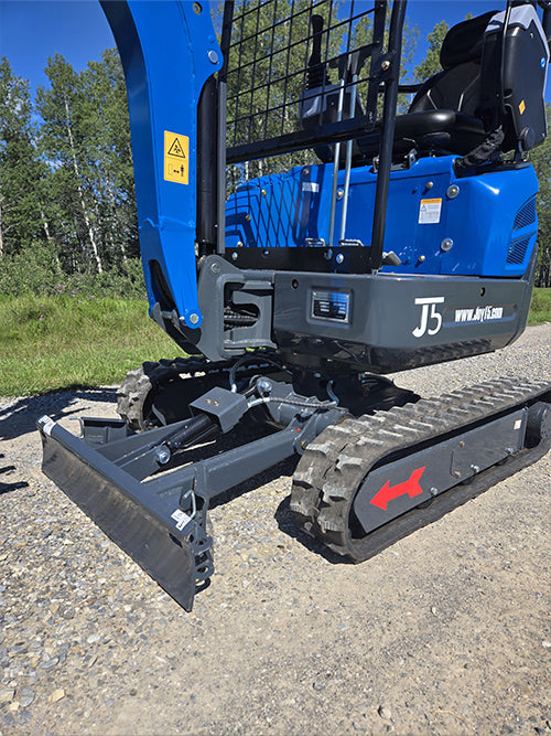 Rippa R15 Mini excavator for sale front blade and rubber track close-up view on gravel road