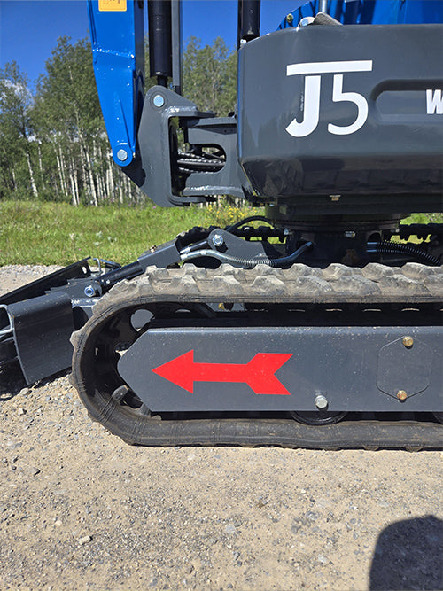 Close-up view of rippa r15 mini excavator for sale J5 rubber track and undercarriage with red arrow marking
