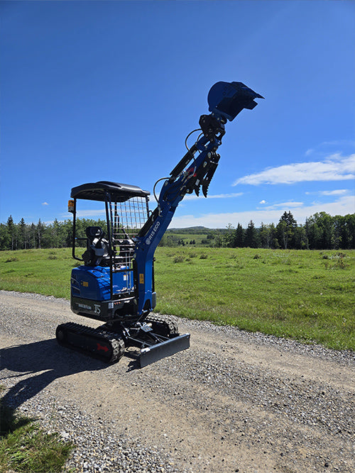 rippa r15 Mini excavator for sale R15 with raised boom and bucket working on gravel road in open field