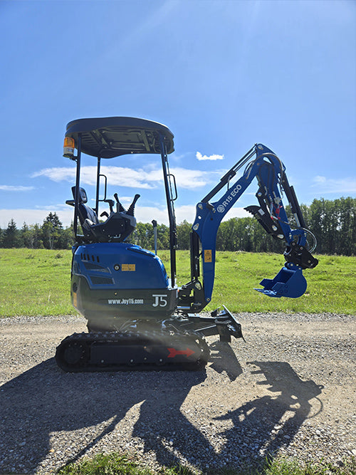Compact rippa r15 mini excavator for sale side profile on gravel path with digging bucket