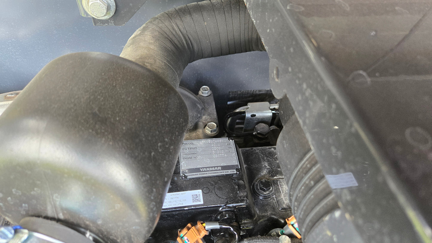 Yanmar diesel engine serial label and air intake system inside JT5600 6 ton mini excavator for sale in Canada, reliable compact excavator for construction and site work