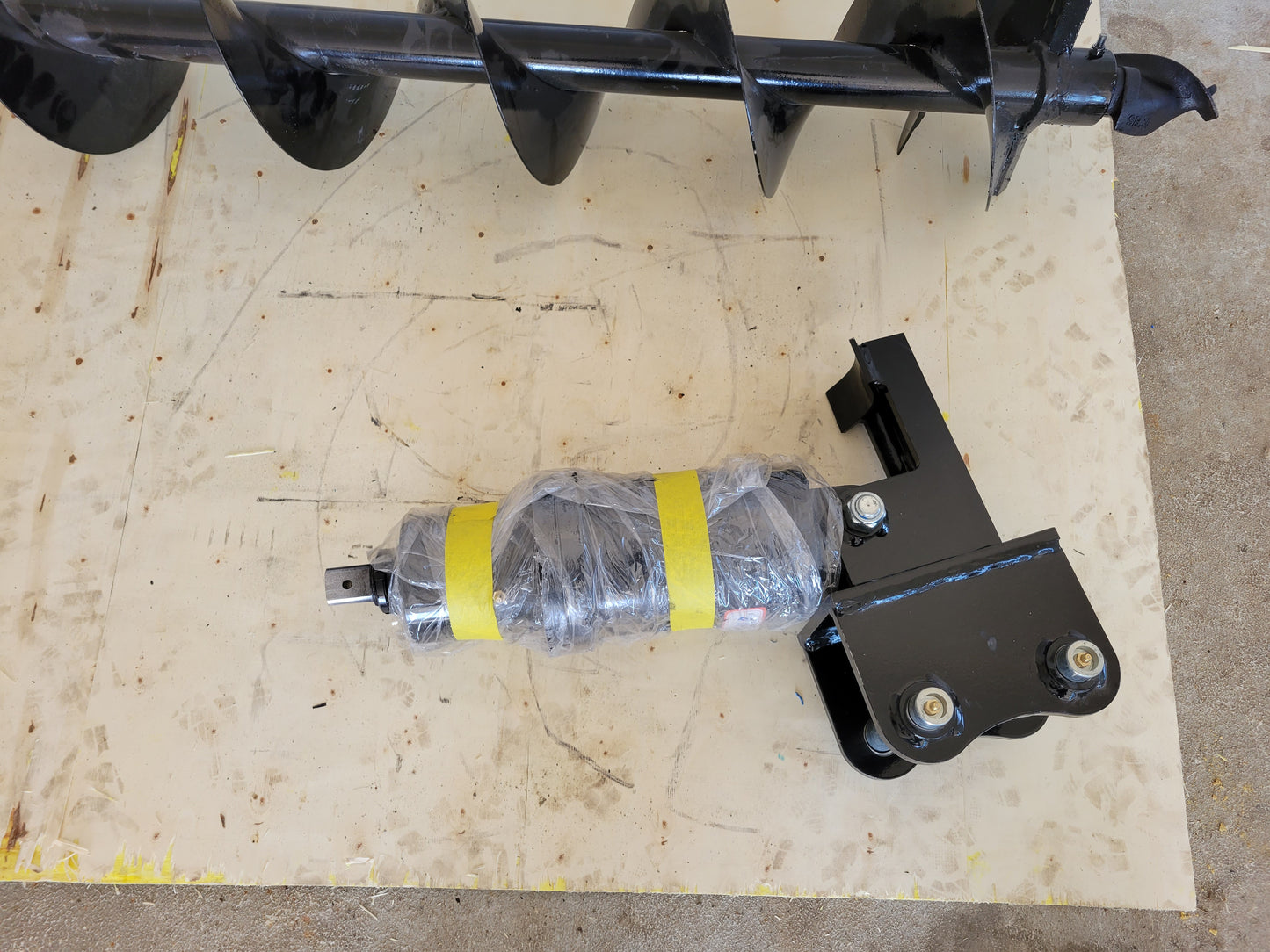 Hydraulic auger drive unit attachment for excavators by JoyT5, durable and heavy-duty design.