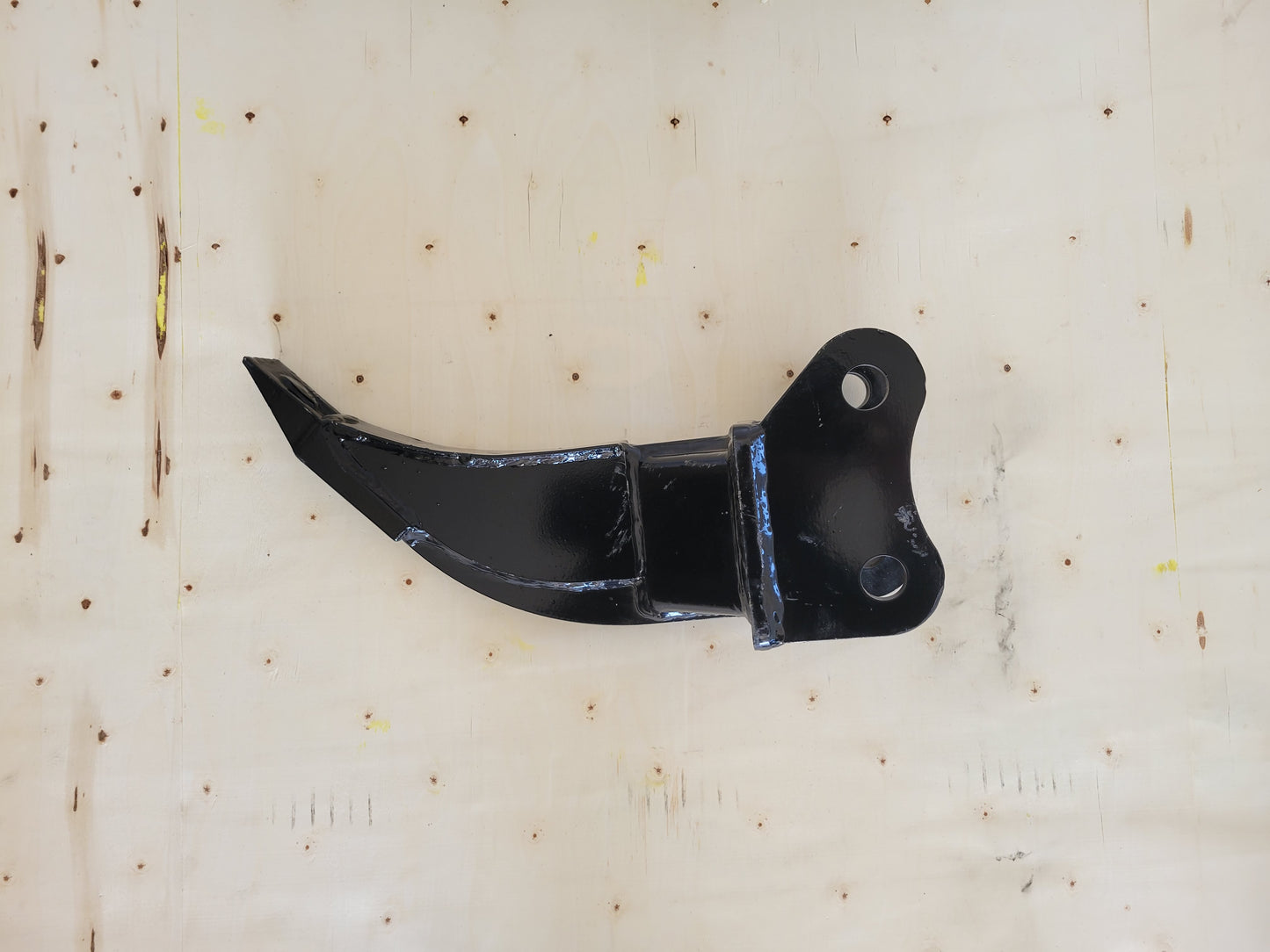 Compact mini excavator ripper attachment with single tooth for breaking hard soil, roots, and frozen ground