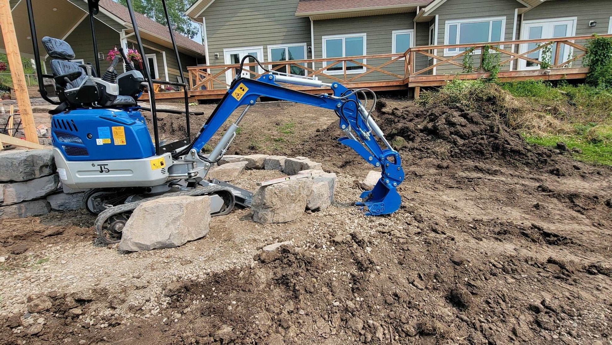 1.2 ton mini excavator digging soil for residential landscaping in Calgary Alberta compact machine rental for garden and light construction work

