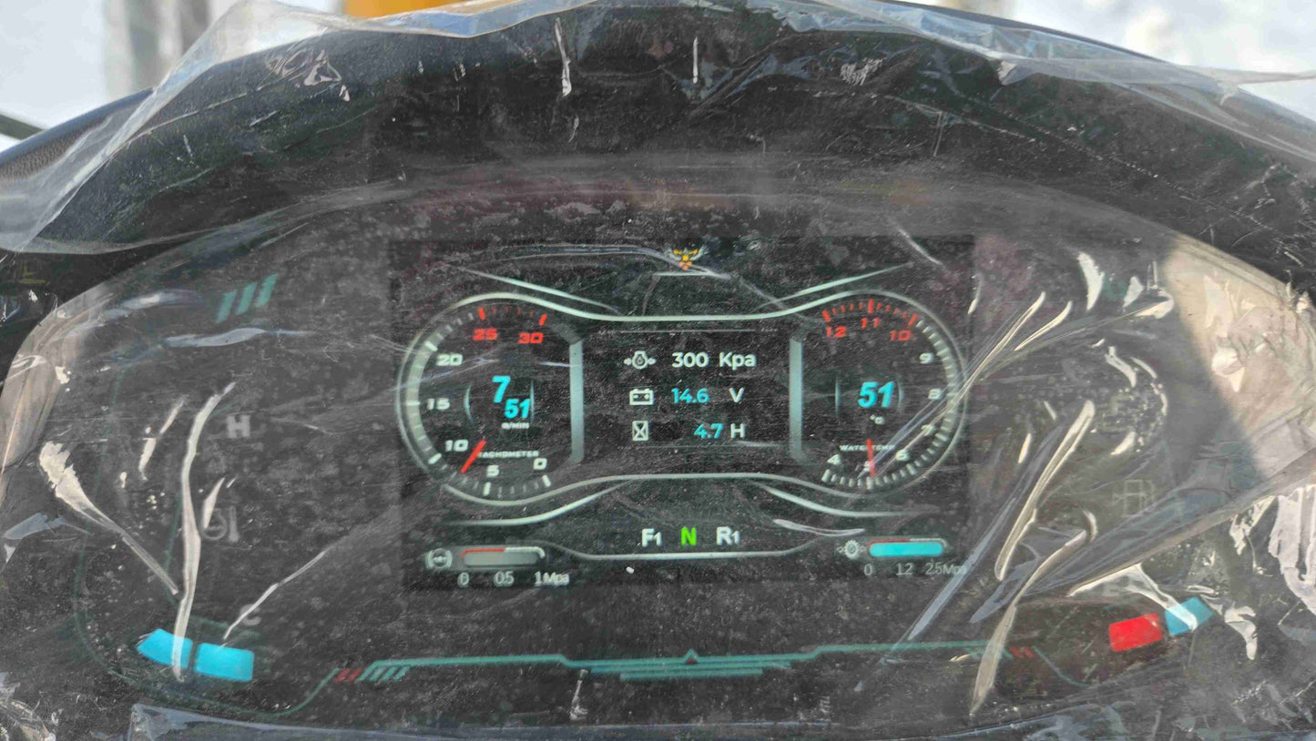 close up of 1.5 ton compact wheel loader dashboard showing digital gauges speed indicators and system readings in Canada

