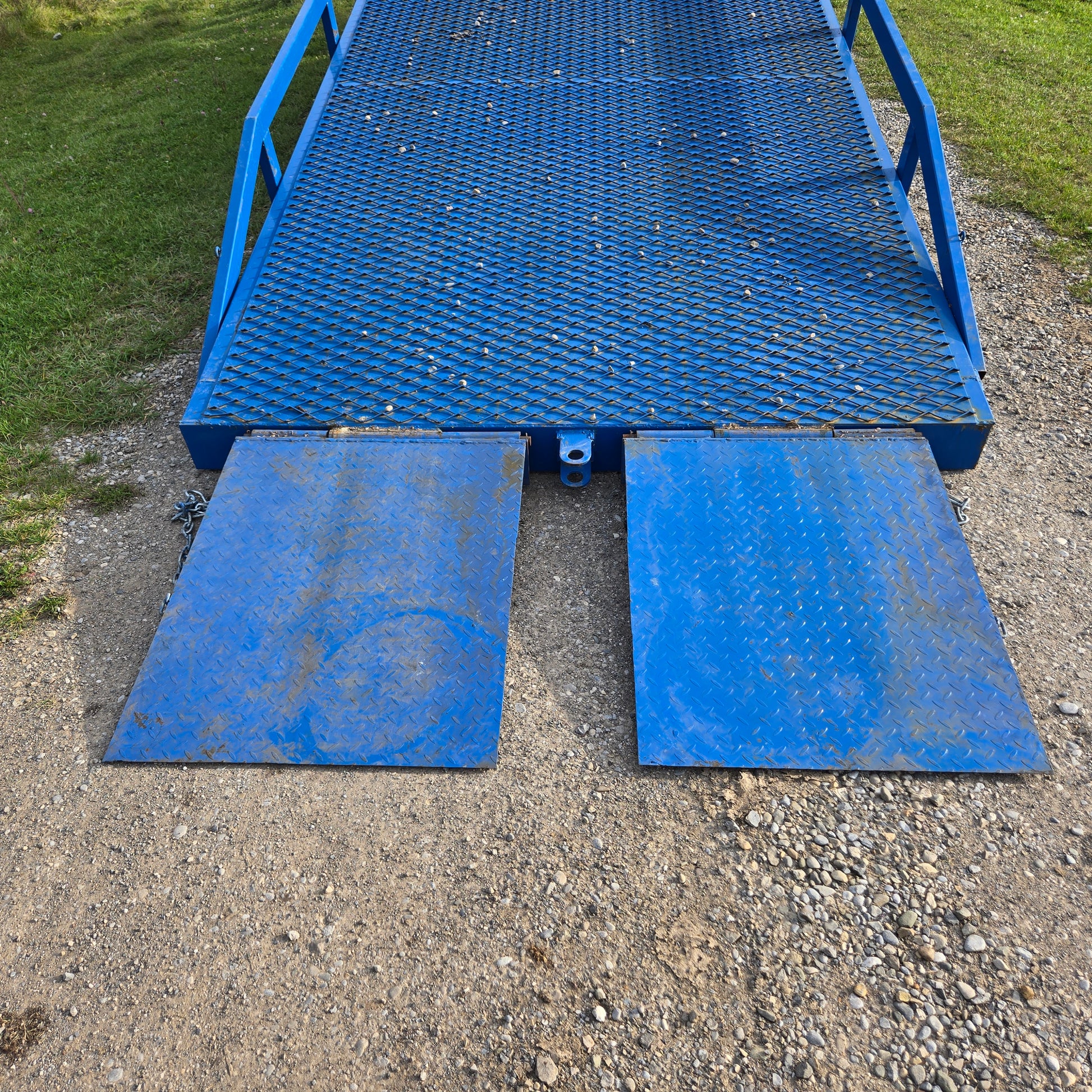 Twelve ton mobile loading ramp entry view showing blue steel platform with grip surface for forklift and truck container loading in Canada


