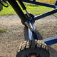 Close up hydraulic wheel system of twelve ton mobile loading ramp showing strong tire and lift mechanism for forklift and truck loading in Canada

