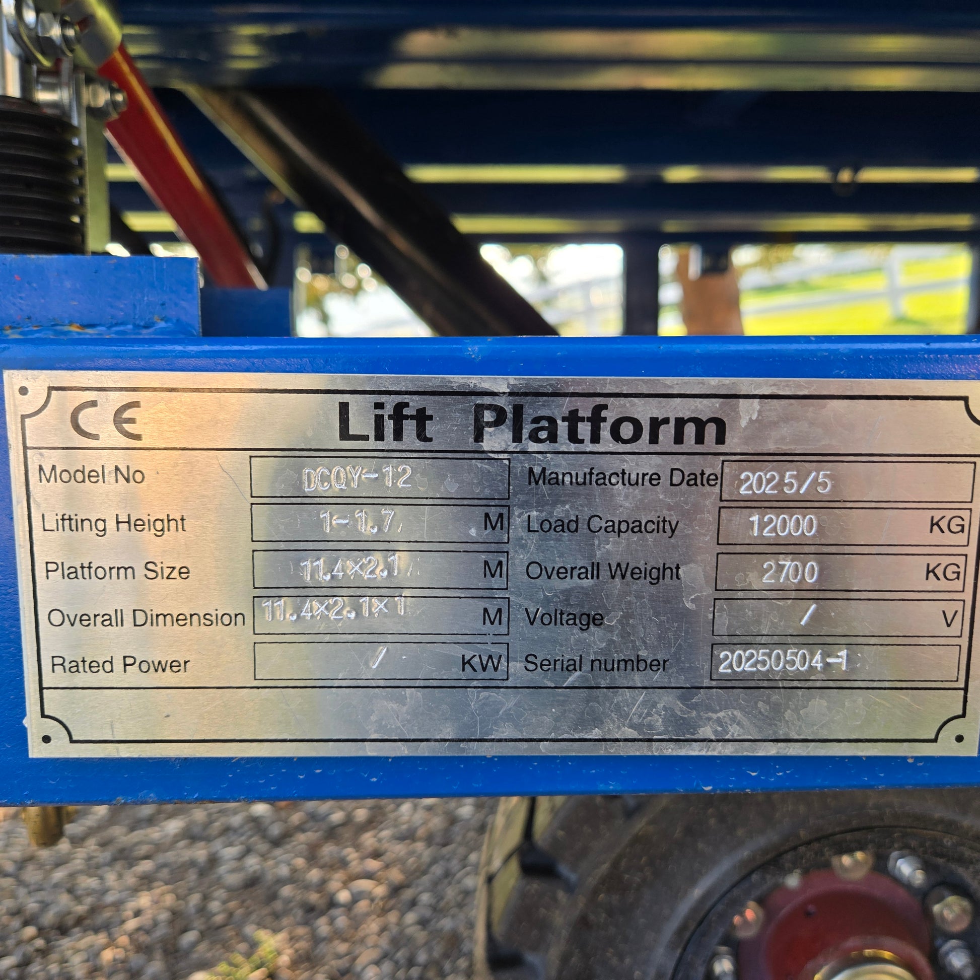Close up view showing specification plate of twelve ton mobile loading ramp with lifting height load capacity and model information in Canada



