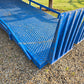 Twelve ton blue steel mobile loading ramp side angle showing grip platform and safety rails used for forklift and truck container loading in Canada


