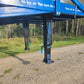 Close up view of twelve ton blue steel mobile loading ramp support leg showing adjustable height mechanism and sturdy frame for truck loading in Canada
