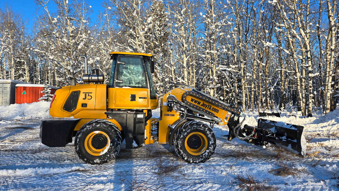 2.5 ton compact wheel loader pushing snow on a winter site in Canada suitable for construction agriculture and snow removal powered by Cummins engine

