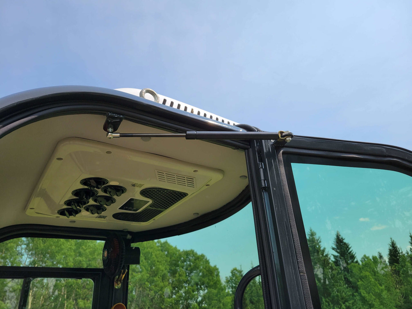 2 ton mini excavator full cab interior ceiling with air vents and door support system in Calgary Alberta for compact excavator rental and operator comfort


