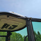 Cabin detail of JoyT5 JT5200 2 ton mini excavator for rent in Calgary, Alberta air‑conditioned compact excavator showing roof vents and sturdy door system for operator comfort in Canada.

